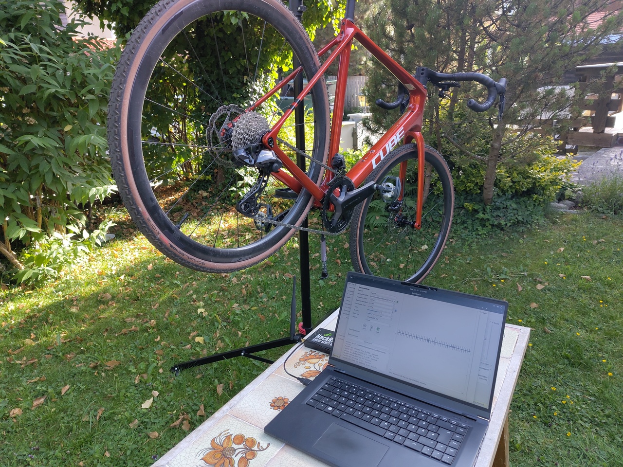 Picture of the Attack setup with the bicycle in a stand and my laptop with the HackRF One